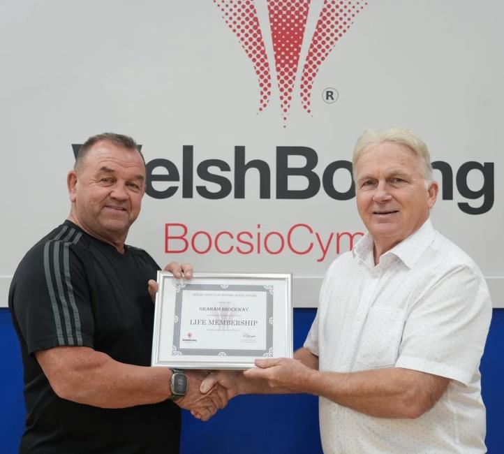 Graham Brockway receives his certificate of Life  Membership from a WABA official Colin Medson